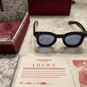 Jaques Marie Mage Loewy. Navy color blue lens.
